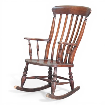 Lot 372 - An early 20th century splat back rocking chair