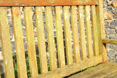 Lot 665 - A teak garden bench
