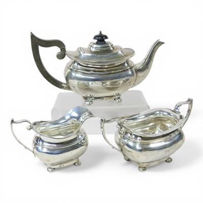 Lot 1 - An early 20th century silver three piece tea...