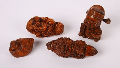 Lot 150 - Four Japanese miniature wooden carvings