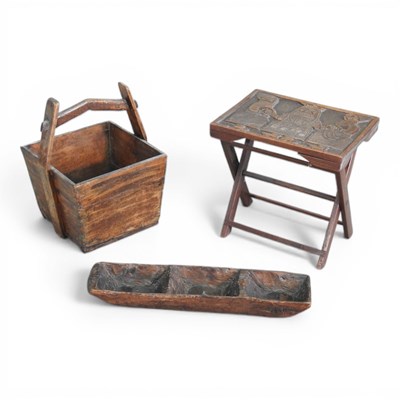 Lot 656 - An African Benin carved hardwood tray table,...