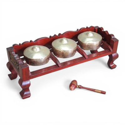 Lot 133 - An Indonesian bonang barung, with three gongs,...
