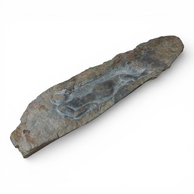 Lot 75 - A rock fragment, carved with a reclining...