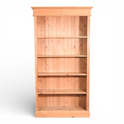 Lot 652 - A modern pine standing open bookcase, on a...
