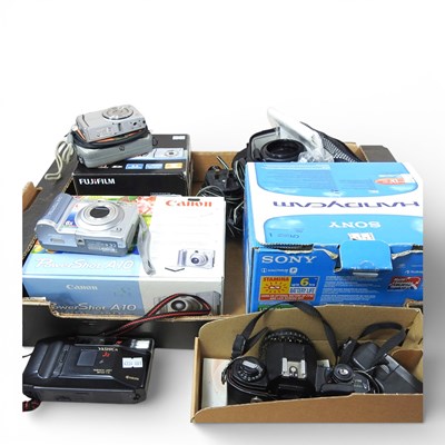 Lot 210 - A Nikon EM camera, together with Panasonic...
