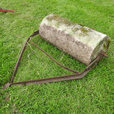 Lot 601 - A heavy flat stone roller, with an iron frame