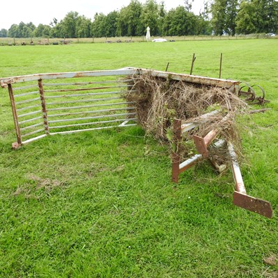 Lot 603 - An iron safety frame for a digger