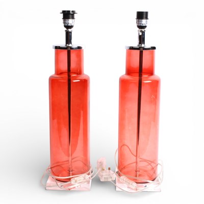 Lot 666 - A pair of modern cranberry glass table lamps,...