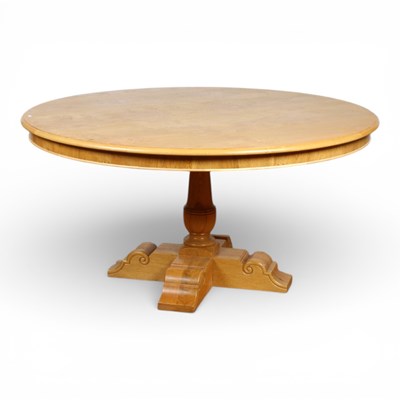 Lot 342 - A large light oak circular dining table,...
