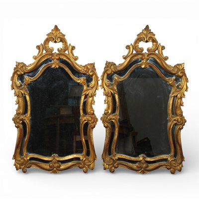 Lot 341 - A pair of Rococo style gilt wall mirrors, each...