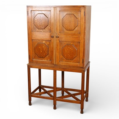 Lot 184 - An early 20th century oak cupboard on stand,...