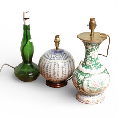 Lot 318 - A collection of lamps to include a Chinese...