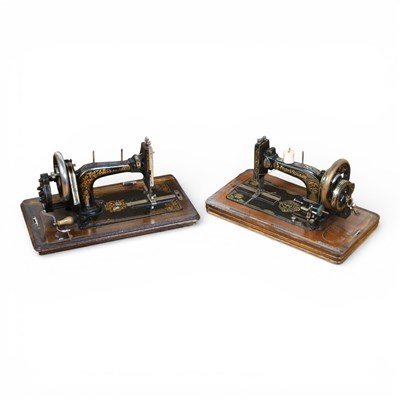 Lot 549 - Two walnut cased sewing machines, 30x46x24cm.