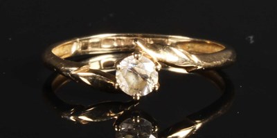 Lot 56 - A 9 carat yellow gold cubic zirconia crossover...