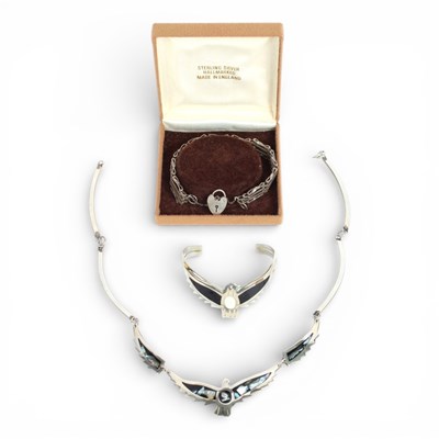 Lot 58 - A silver gatelink bracelet, with heart shaped...