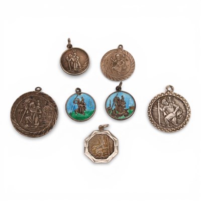 Lot 82 - A collection of seven silver St Christopher's...