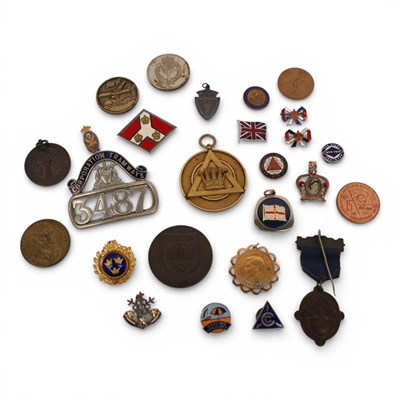 Lot 65 - A collection of medals and badges, to include...