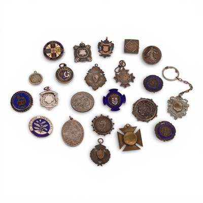 Lot 66 - A collection of medals and badges, to include...
