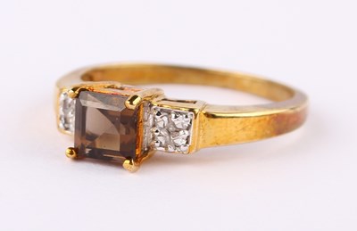 Lot 29 - A 9 carat yellow gold smoky quartz and white...