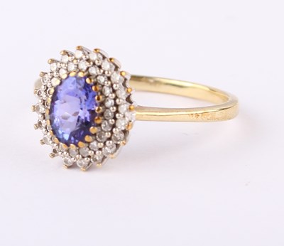 Lot 20 - A 9 carat gold tanzanite and diamond cluster...