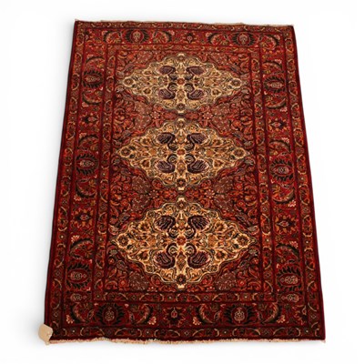 Lot 149 - A Persian Isfehan rug, floral decoration on a...