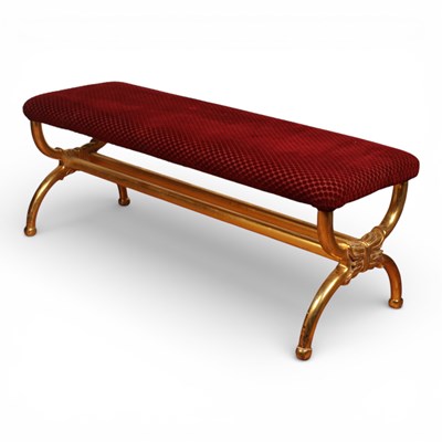 Lot 294 - A Regency style carved gilt wood stool, the...