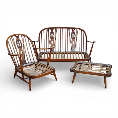 Lot 333 - An Ercol dark elm Prince of Wales two seater...