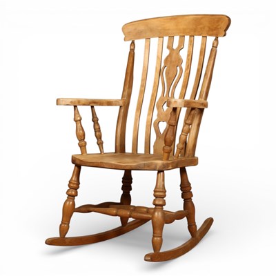 Lot 99 - A beech rocking chair