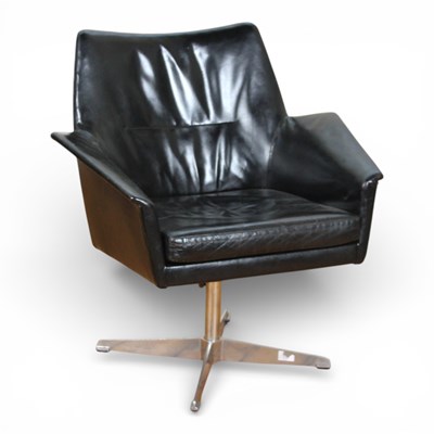 Lot 103 - A mid century black leather upholstered swivel...