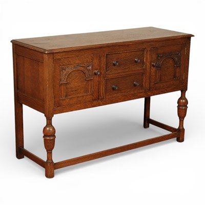 Lot 687 - A 20th century carved oak dresser base, having...