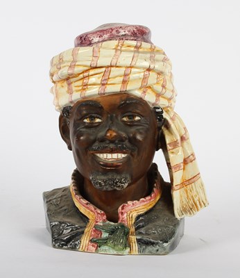 Lot 286 - A pottery jar, in the form of a man wearing a...