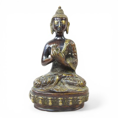 Lot 71 - A Tibetan bronze statue of Buddha, shown...