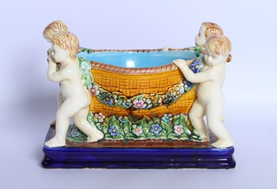 Lot 177 - A majolica bowl, decorated with putti and...