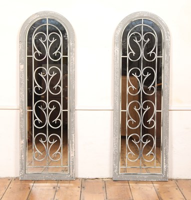 Lot 594 - A pair of grey arch garden mirrors, 123 x 40cm
