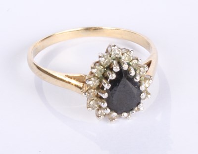 Lot 12 - A 9 carat yellow gold pear shaped sapphire and...