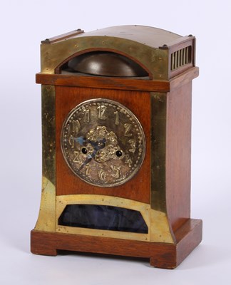 Lot 147 - An Arts and Crafts oak and brass mounted...