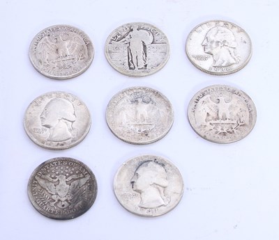 Lot 95 - A collection of eight US silver quarter dollar...