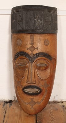 Lot 266 - An African Malawi tribal carved hardwood mask,...