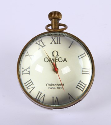 Lot 253 - A glass and brass ball clock, 7.5x6cm
