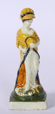 Lot 192 - A Prattware pottery figure emblematic of...