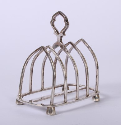 Lot 45 - A George VI silver four division toast rack,...
