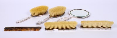 Lot 46 - A George V silver-backed six piece dressing...