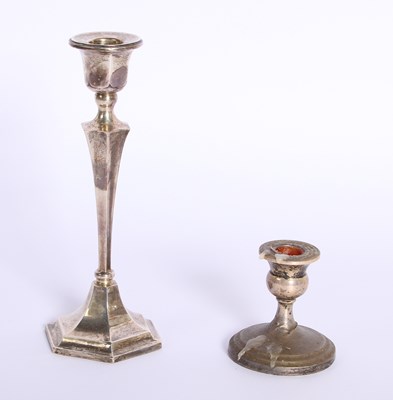 Lot 80 - Two silver candlesticks comprising a George V...
