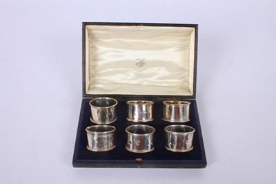Lot 55 - A set of six silver napkin rings, marks rubbed,...