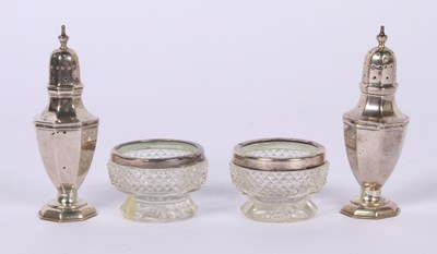 Lot 75 - A pair of George V silver peppers, London 1927,...