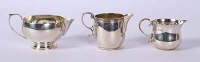 Lot 39 - A George VI silver milk jug, Birmingham 1940,...