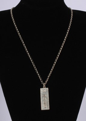 Lot 63 - A silver ingot on a long chain necklace, 50g...