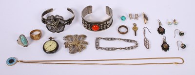 Lot 65 - A collection of white and yellow metal jewelry...