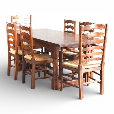 Lot 685 - A modern oak refectory dining table, on turned...