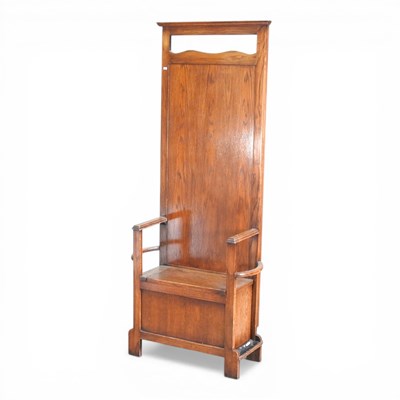 Lot 710 - An early 20th century oak settle, with a...